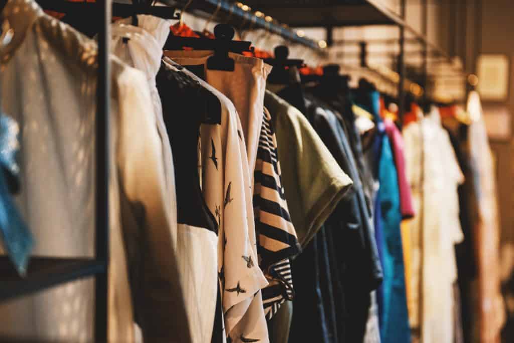 clothes on rack, fast fashion problems and environmental concerns