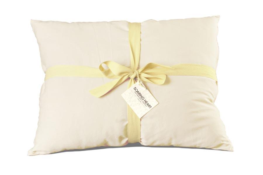 Pillow with yellow ribbon wrapped around it