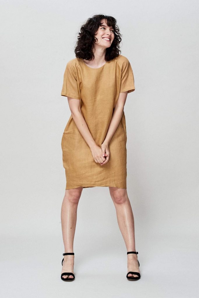 women in tan organic linen shirt from organic clothing brand neu nomad. 