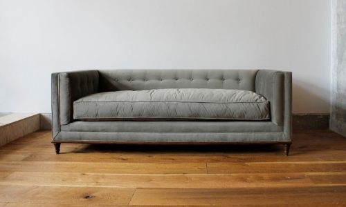 modern non-toxic couch in light grey with large single pillow 