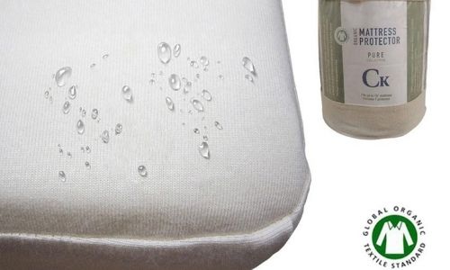GOTS certified organic mattress protector with water droplets beading on the mattress. 