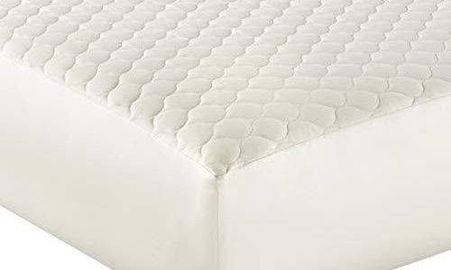 quilted non-toxic mattress protector on a bed