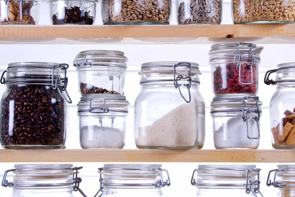 Non-Toxic Kitchen - Glass storage containers filled with grains, coffee, and food storage