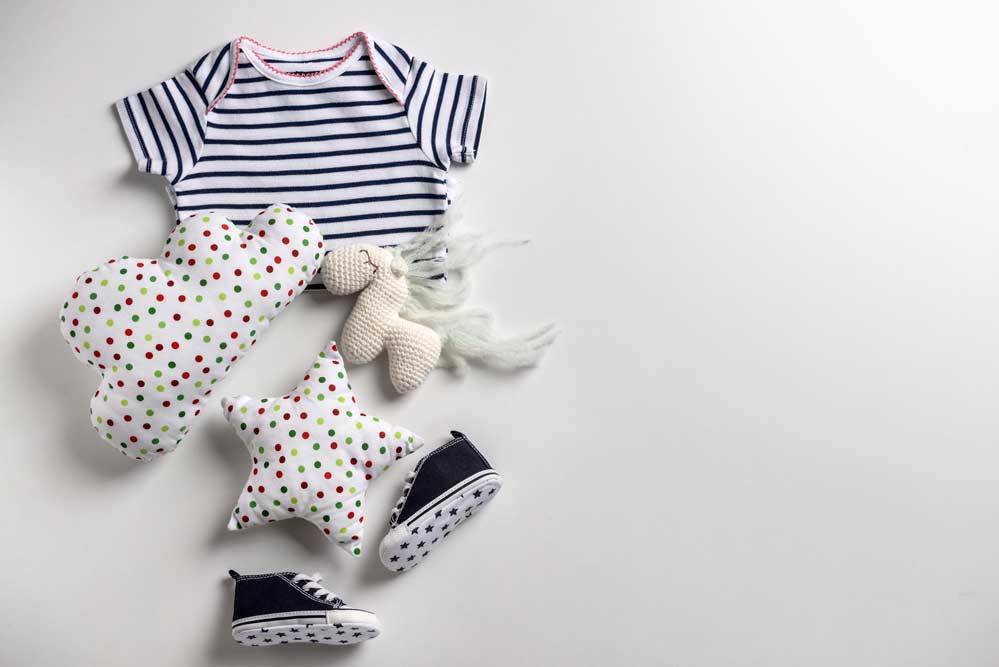 Image of Baby Stripped Clothes and Poka Dot Stuffed Animals