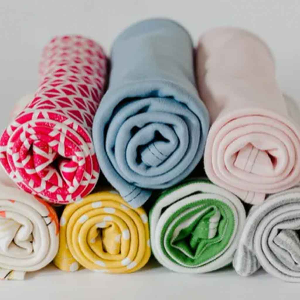 Sunrise Bliss Organic Towels, colorful organic towels rolled up