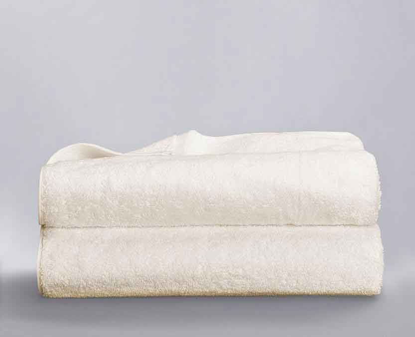 Sol Organix Towels White towels folded and stacked on top of each other