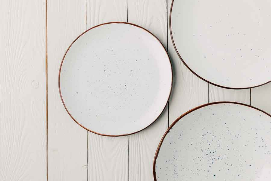 3 Plates on Wooden Background