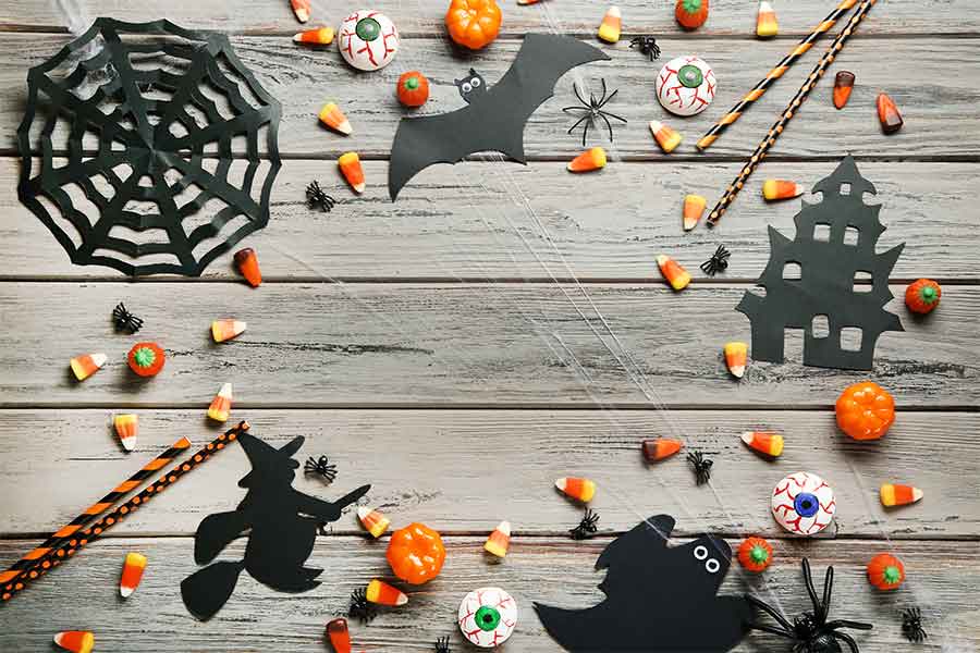 Halloween Arts and Crafts, Pencils, Candy, Paper cut outs, on a wooden table