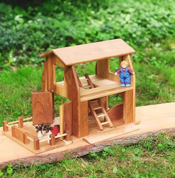 Wooden Play BarnHouse on grass 