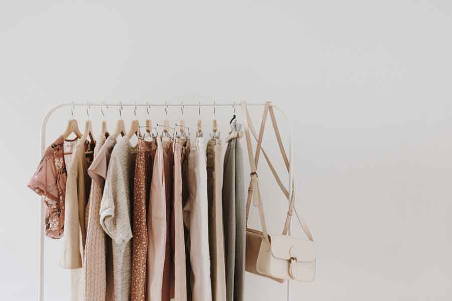 Image of a Minimal Clothing Rack with some clothes and purses